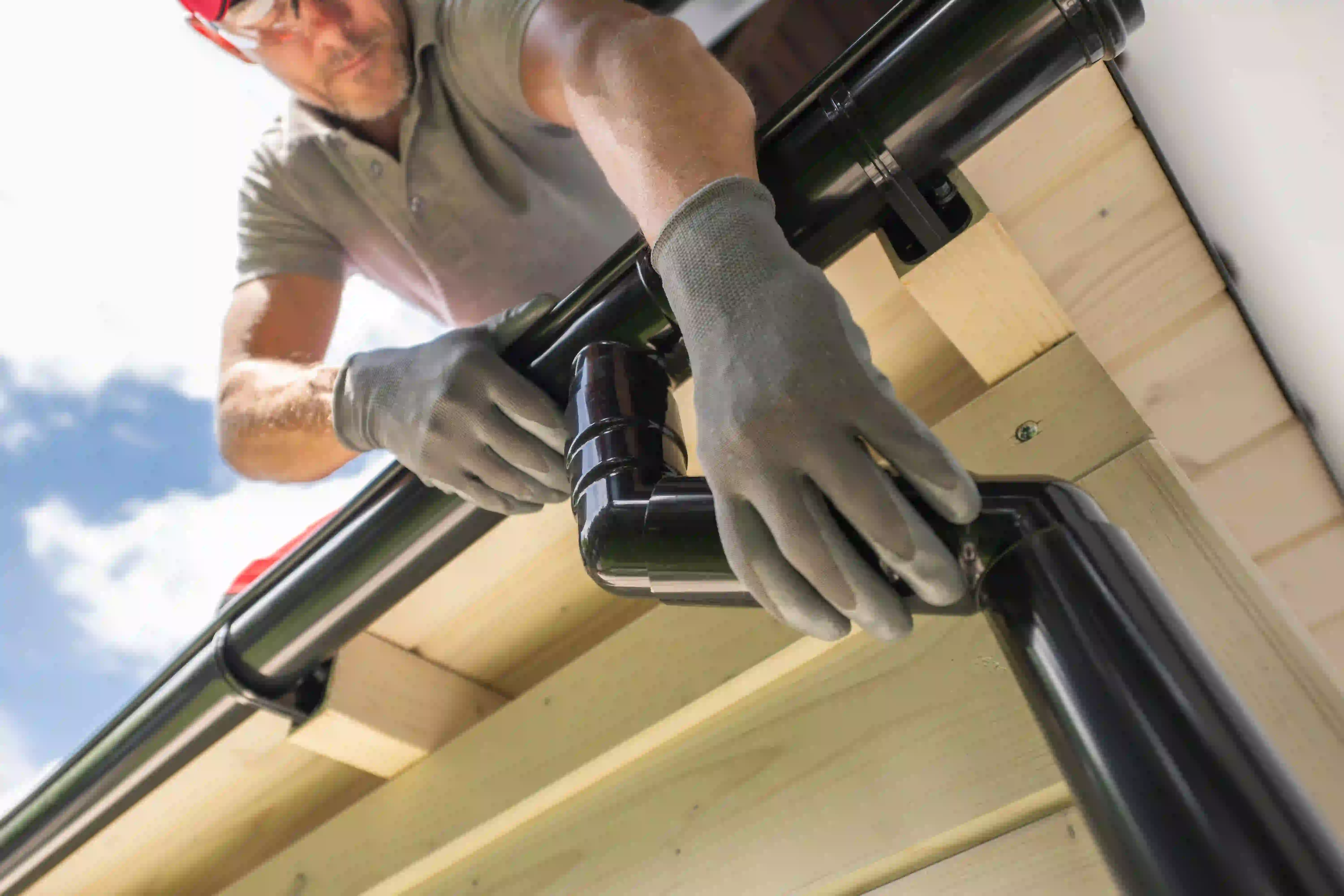Gutter system installation on residential roof